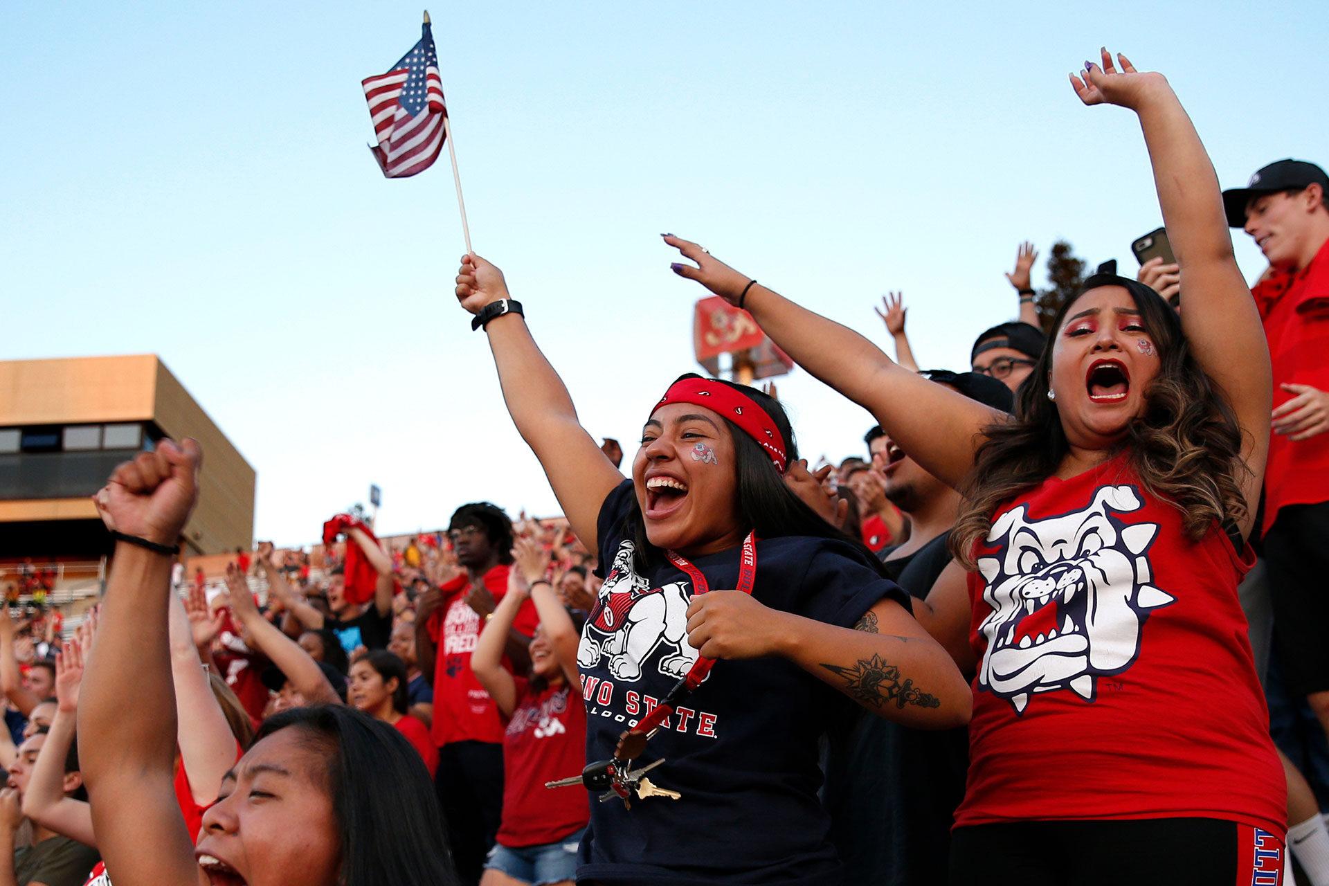Students cheering on the ’Dogs at a home football game