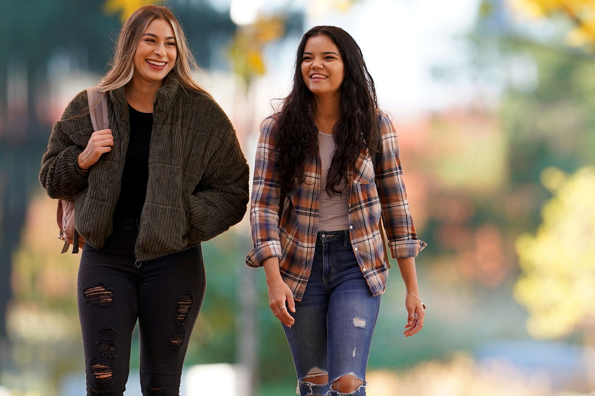 Students walking on campus during the fall Photo